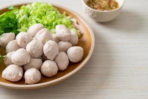 pork meatball with vegetable and spicy sauce photo