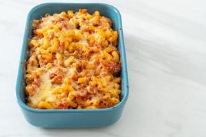 homemade macaroni bolognese with cheese photo