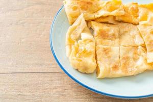 roti with egg and sweetened condensed milk photo