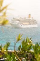 Cruise ship near the Mykonos island, Cyclades in Greece. photo