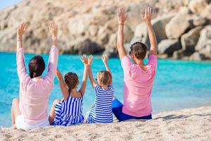 Family with kids on the beach photo