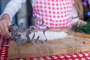 Christmas shapes pastry cutters on wooden board photo