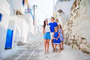 Happy family of four in Greece photo