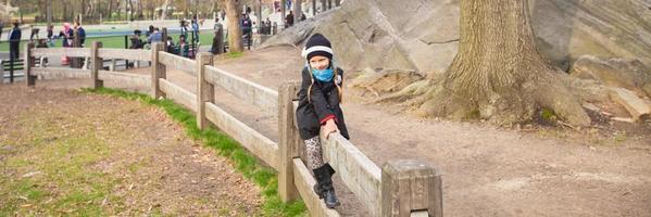 Adorable little girl have fun in Central Park at New York City photo