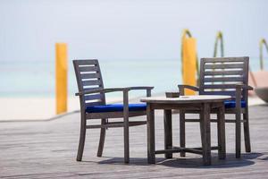 Summer empty outdoor cafe at exotic island in indian ocean photo