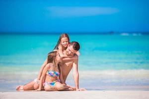 Father and kids enjoying beach summer vacation photo