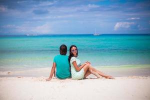 Young happy couple have fun on brach vacation photo