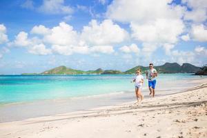 Father and kids enjoying beach summer vacation photo