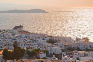 Top view of the old city and the sea on the island of Mykonos in evening lights photo