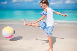 Young beautiful girl having fun on tropical seashore. photo