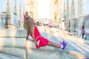 Adorable little girl on the rooftop of Duomo, Milan, Italy photo