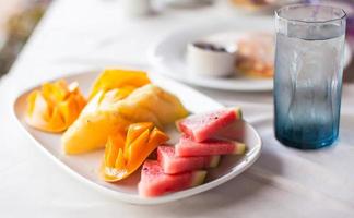 Healthy breakfast on the table close up in outdoor cafe photo