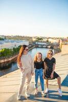 Family on rooftop enjoying with view of beautiful sunset in Sankt Petersburg in Russia photo