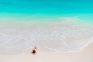 Young woman in bikinin on the beach photo