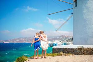 Kids with amazing view on Little Venice the most popular tourist area on Mykonos island photo