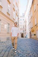 Young man background the old european city take selfie photo