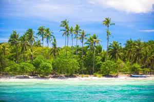 Landscape of tropical island beach with perfect blue sky photo