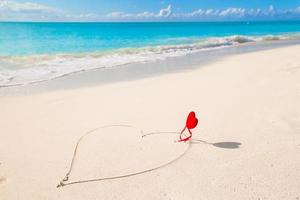 Heart written in white sandy tropical beach photo