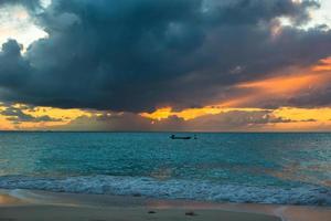 Sailing boat in beautiful sunset photo