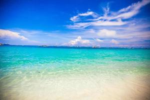 Turquoise water and white sand photo