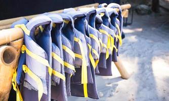 Gree lifejackets on the white beach photo