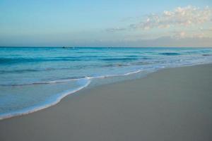 White sandy beach with turquoise water at perfect island photo