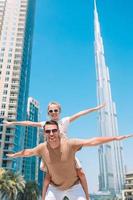 Happy family of dad and kid walking in Dubai photo