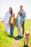 Adorable family on vacation on the lake photo