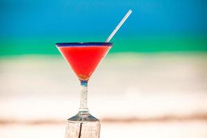 Strawberry margarita on the sandy white beach photo