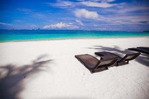 Beach Chairs on beautiful island in white sand plage photo