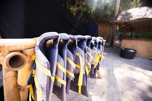 Gree lifejackets on the white beach photo