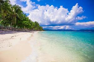 Perfect beach with green palms,white sand and turquoise water photo