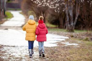 Adorable little girls outdoors in the forest photo