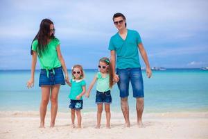 Happy family during summer beach vacation photo
