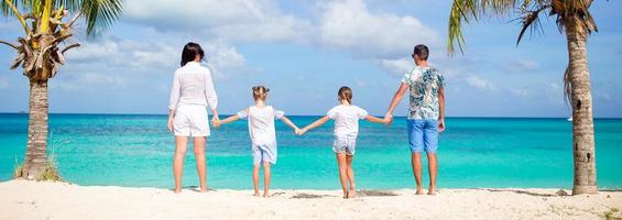 Young family on vacation on the beach photo