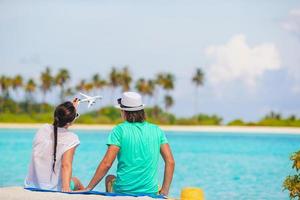 picture of happy couple in sunglasses on the beach photo