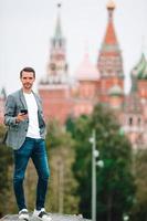 Happy young urban man in european city. photo