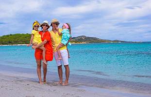 Happy family during summer beach vacation photo
