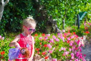 Adorable little girl at tropical vacation photo