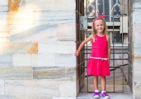 Adorable little girl on the rooftop of Duomo, Milan, Italy photo