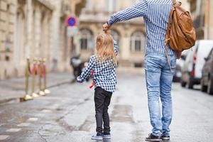 Father and his little daughter outdoors in European city photo