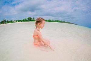 Happy girl enjoy summer vacation on the beach photo