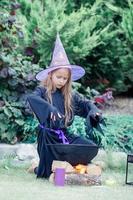 Happy girl in halloween costume with jack pumpkin.Trick or treat photo