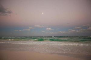 Amazing colorful sunset on exotic beach in Mexico photo