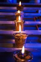 Closeup of burning candles in the Catholic Church photo