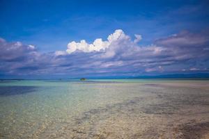 Incredibly clean turquoise water in the sea near tropical island photo