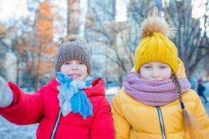 Adorable little girls have fun in Central Park at New York City photo