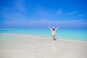 Young woman enjoy tropical beach vacation photo