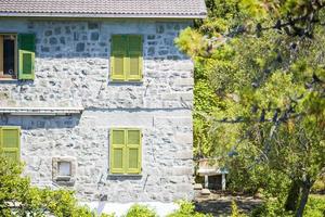 View of one old building against a majestic mountain landscape and italian vineyards in Cinque Terre photo