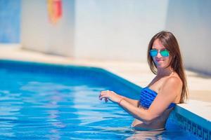 Portrait of happy girl on white sandy beach photo